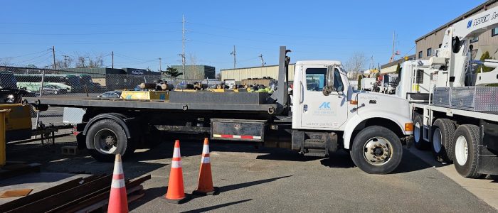 Side view of hook truck for sale.
