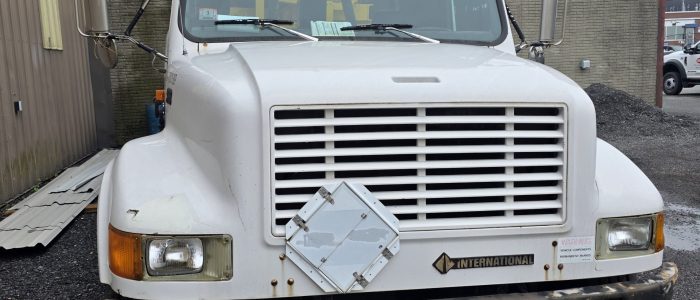 Grill view of hook truck for sale.