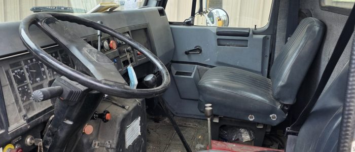 Cabin view of hook truck for sale.